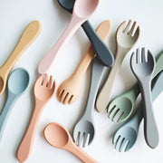 Nibble and Gnaw silicone spoon and fork set in assorted earthy tones, designed for little hands, made from safe, BPA-free, food-grade material.