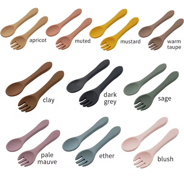 Nibble and Gnaw silicone spoon and fork set in assorted earthy tones, designed for little hands, made from safe, BPA-free, food-grade material, available in Muted, Esther Blue, Dark Grey, Pale Mauve and Sage Green 
